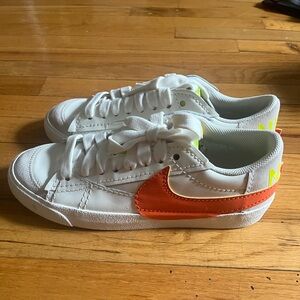 Nike Blazer Low White Sneakers with Orange Swoosh